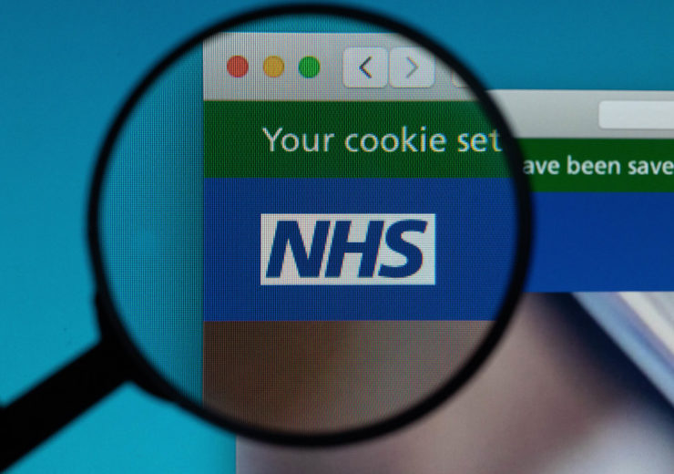 NHS logo under magnifying glass